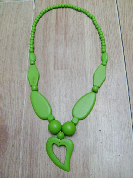 Necklace is made of wood.