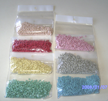 PP repro pellets in various light colors (pink, grey, red, b